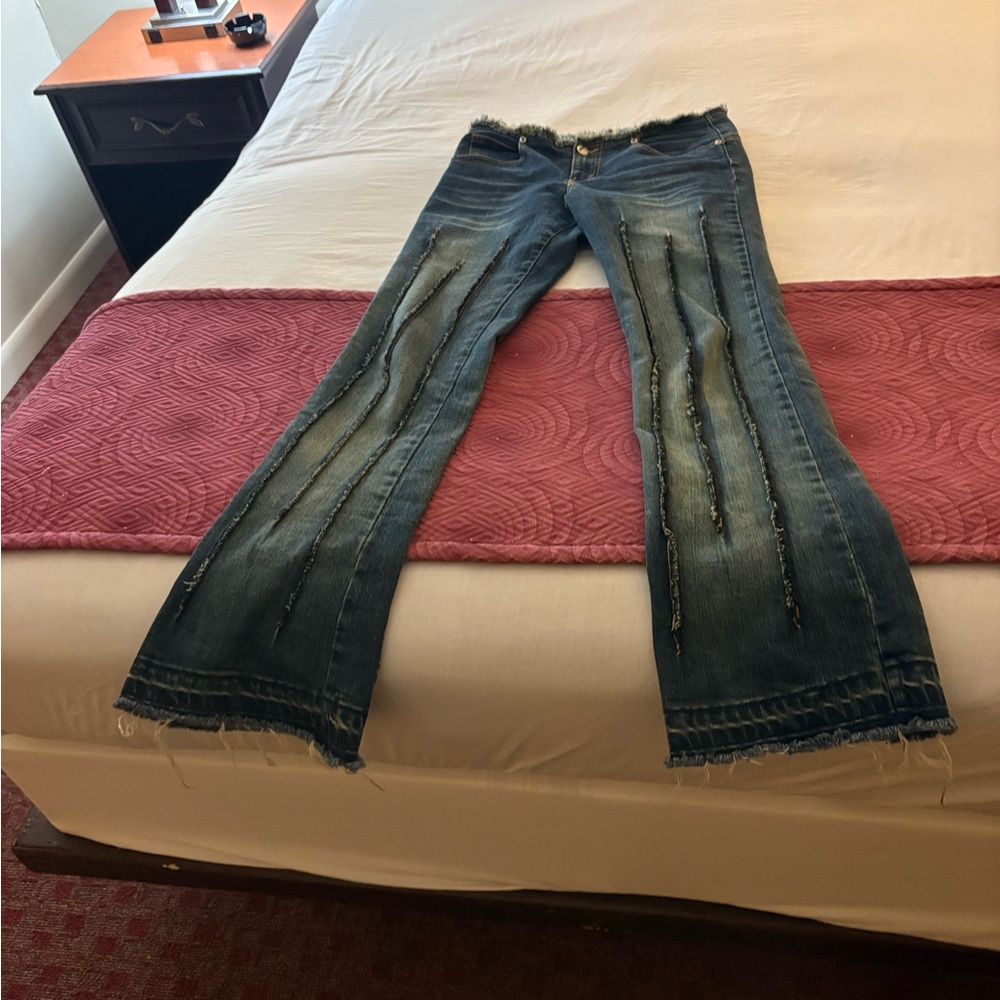 bebe Blue Flare Jeans with Distressed Details